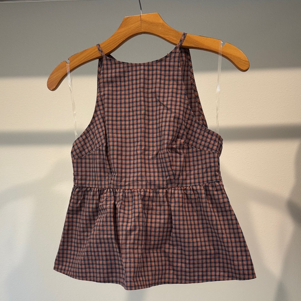 Plaid peplum top with open back detail